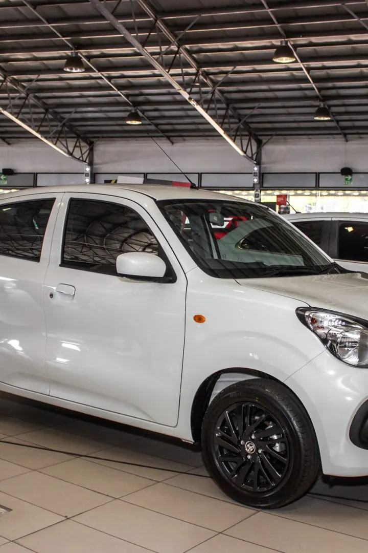 A compact white Teksi fleet car