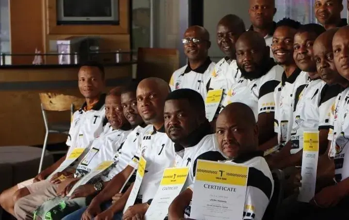 Teksi drivers with their training certificates